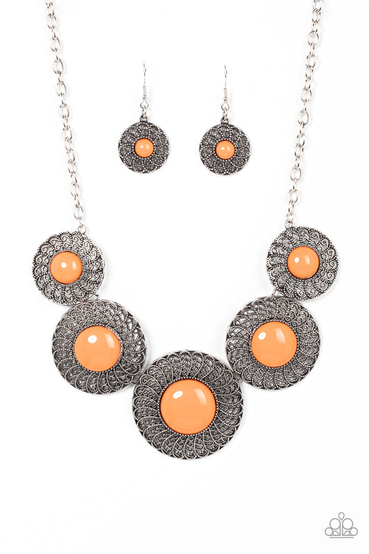 Dotted with bubbly orange beads, silver discs spinning with swirly petal motifs gradually increase in size as they link below the collar for a statement-making floral fashion. Features an adjustable clasp closure.