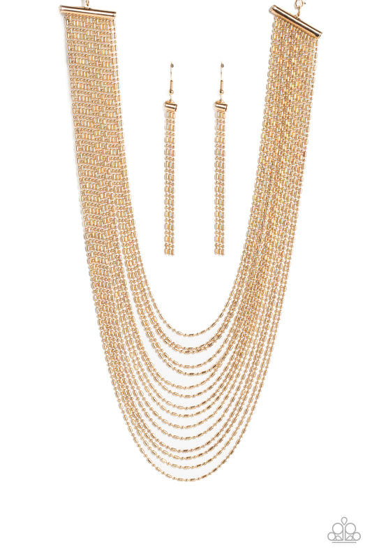 Suspended from two gold, horizontal bars, a shimmery cascade of high-sheen gold ball-and-bar chains layer around the neck for an industrial statement. Features an adjustable clasp closure.