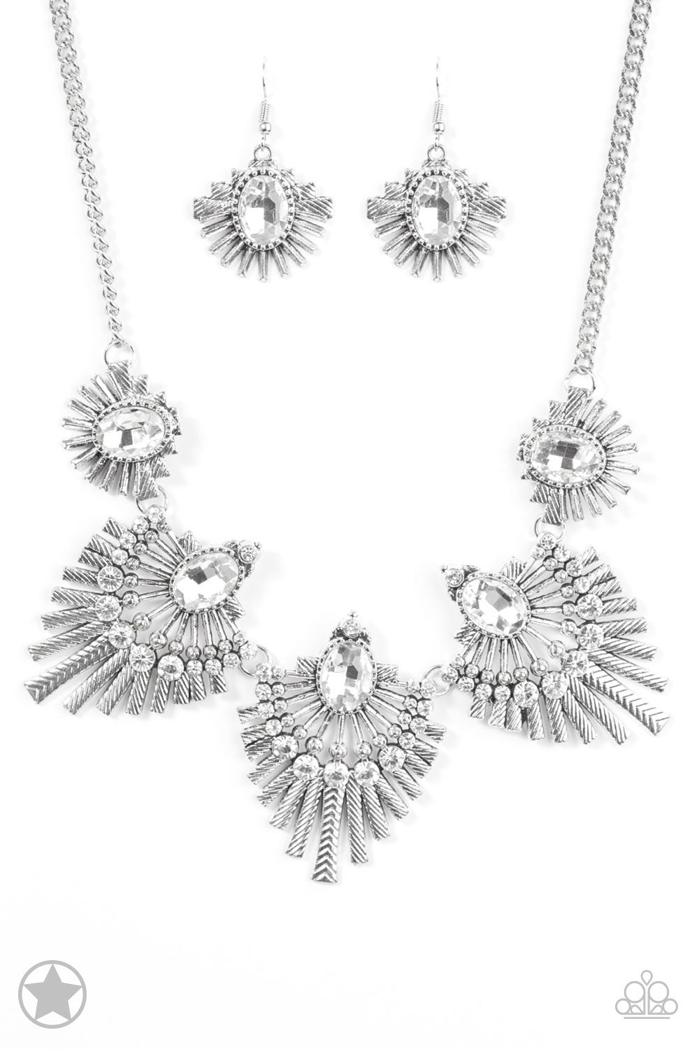 Textured metal bars flare out from a mesmerizing gem, creating a fringe of fanning frames. Sprinkled with matching white rhinestones, the dazzling display falls just below the collar for a sassy finish. Features an adjustable clasp closure.