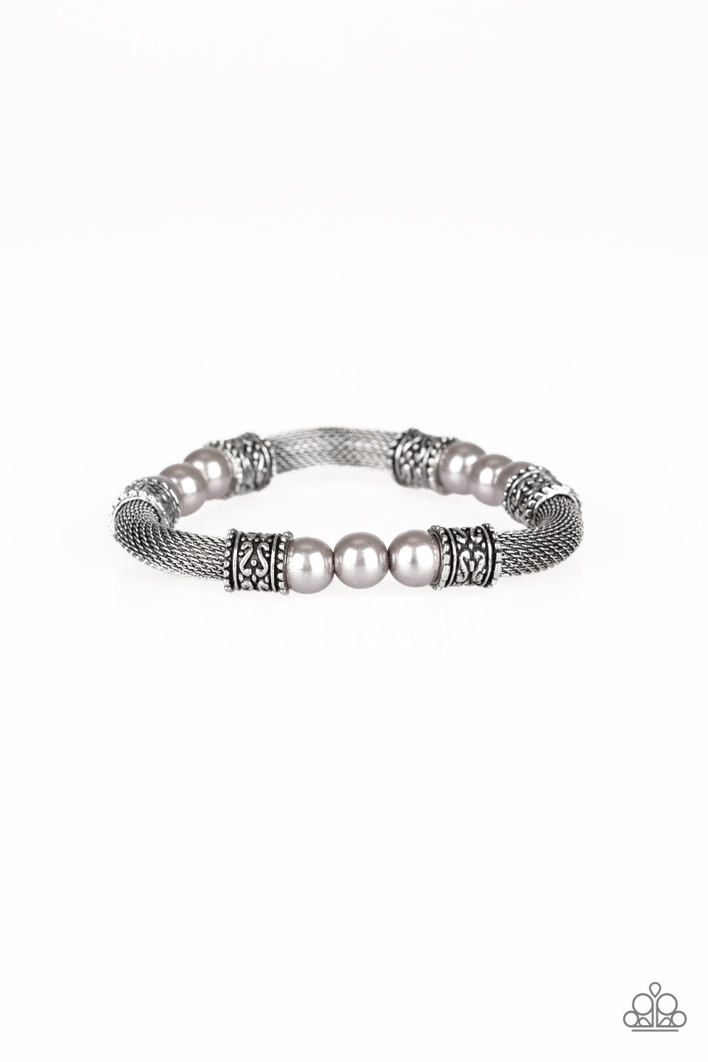 Pearly silver beads, ornate silver accents, and sections of silver mesh chain are threaded along a stretchy band around the wrist for a refined flair.