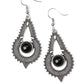 Radiating with studded and rope-like textures, an ornate silver frame joins around a polished black beaded center for a seasonal look. Earring attaches to a standard fishhook fitting.