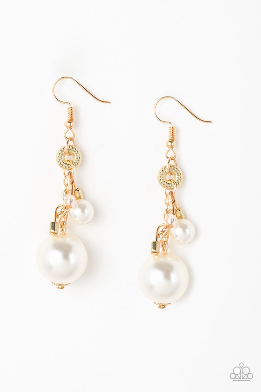 A bubbly white pearl, glassy crystal-like beads, and shimmery gold cube beads trickle along a glistening gold chain. An oversized white pearl swings from the bottom of the chain, creating a dramatic lure. Earring attaches to a standard fishhook fitting
