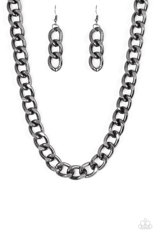 Brushed in a high-sheen shimmer, a bold gunmetal chain drapes below the collar in an edgy industrial fashion. Features an adjustable clasp closure.
