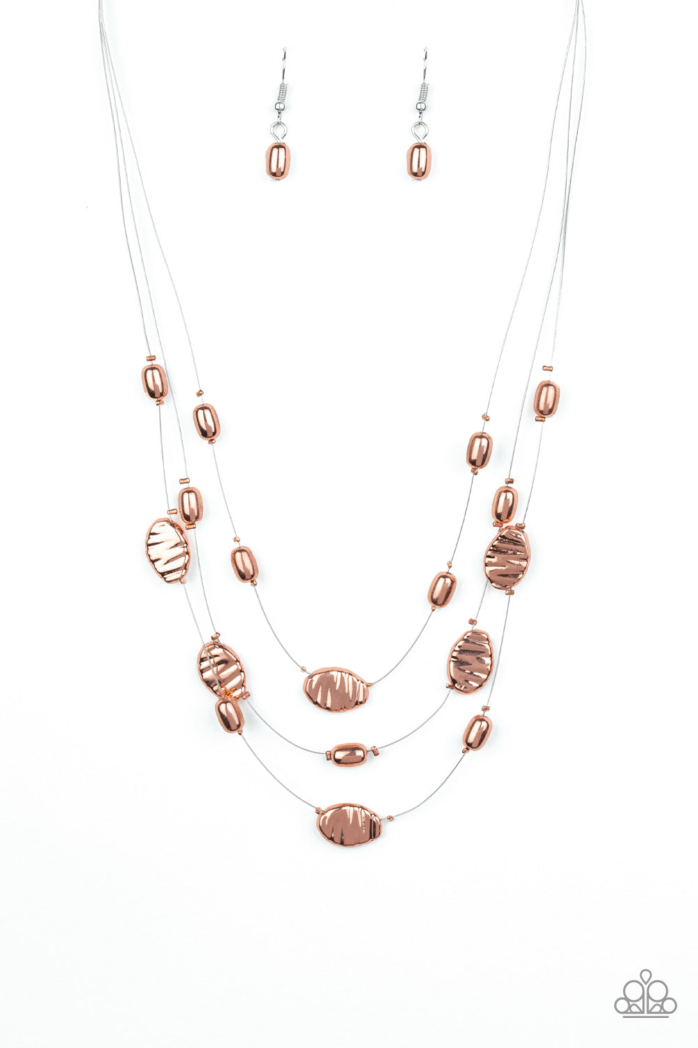 Featuring smooth and delicately hammered finishes, mismatched shiny copper beads are threaded along dainty silver wire, creating floating layers below the collar. Features an adjustable clasp closure.