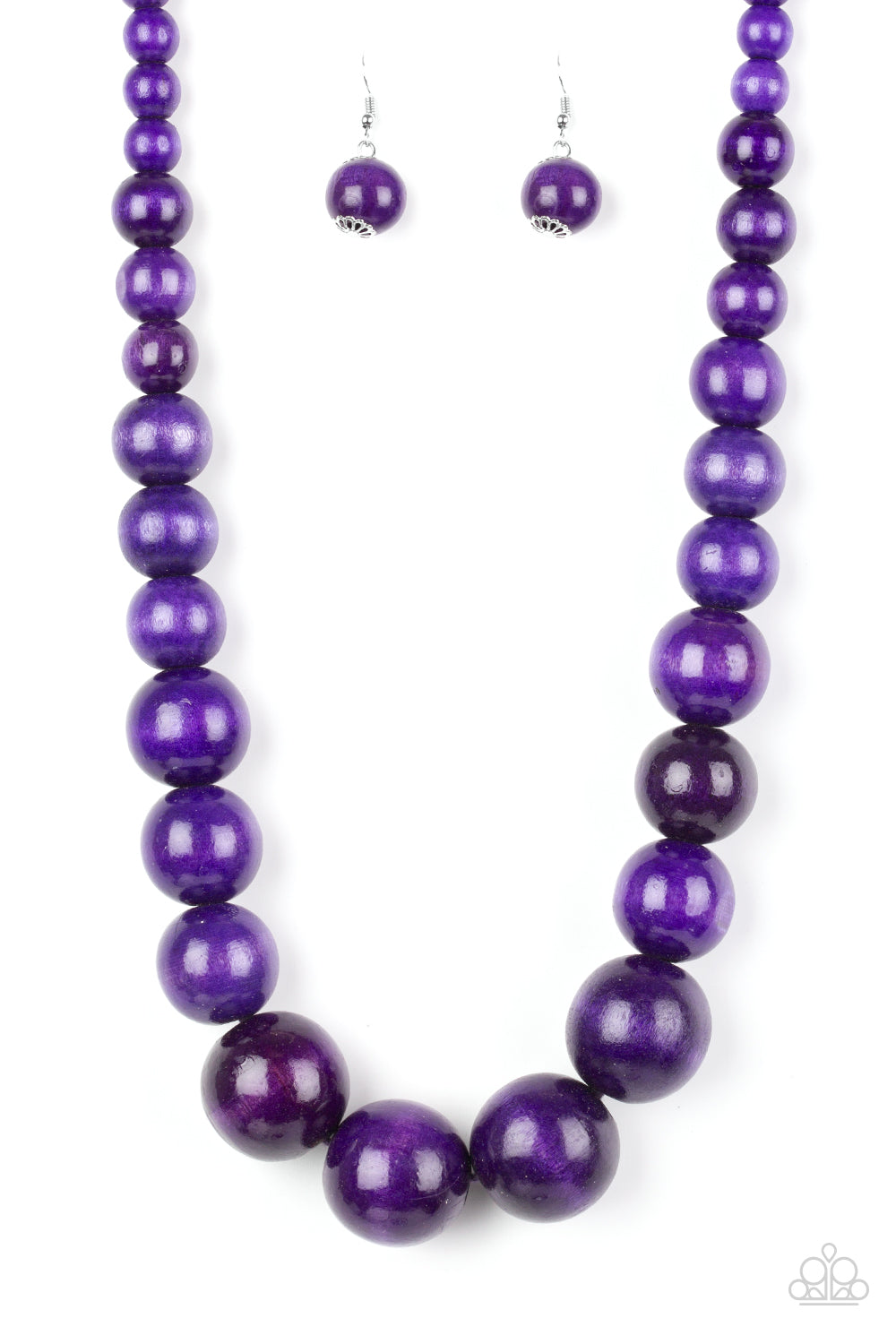 Gradually increasing in size near the center, vivacious purple wooden beads are threaded along a purple string for a summery look. Features an adjustable sliding knot closure.