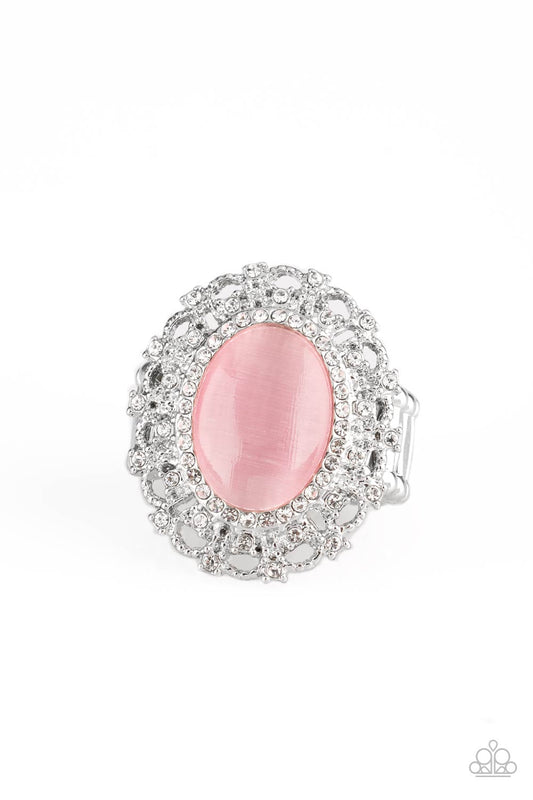 Encrusted in dainty white rhinestones, a frilly silver frame spins around a glowing pink moonstone center for a regal look. Features a stretchy band for a flexible fit.  Sold as one individual ring.