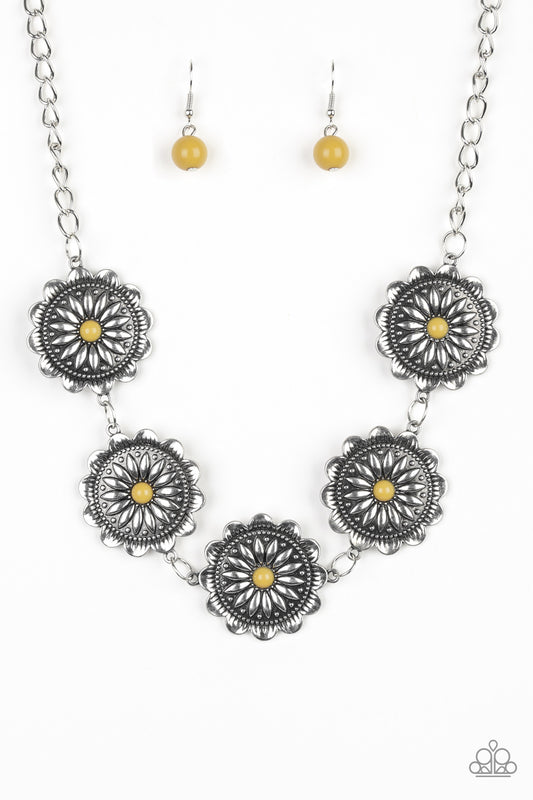Infused with shiny yellow beaded centers, ornate floral stamped frames link below the collar for a colorfully, seasonal look. Features an adjustable clasp closure.