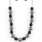 Polished black beads and dramatic silver beads drape below the collar for a perfect pop of color. Features an adjustable clasp closure.