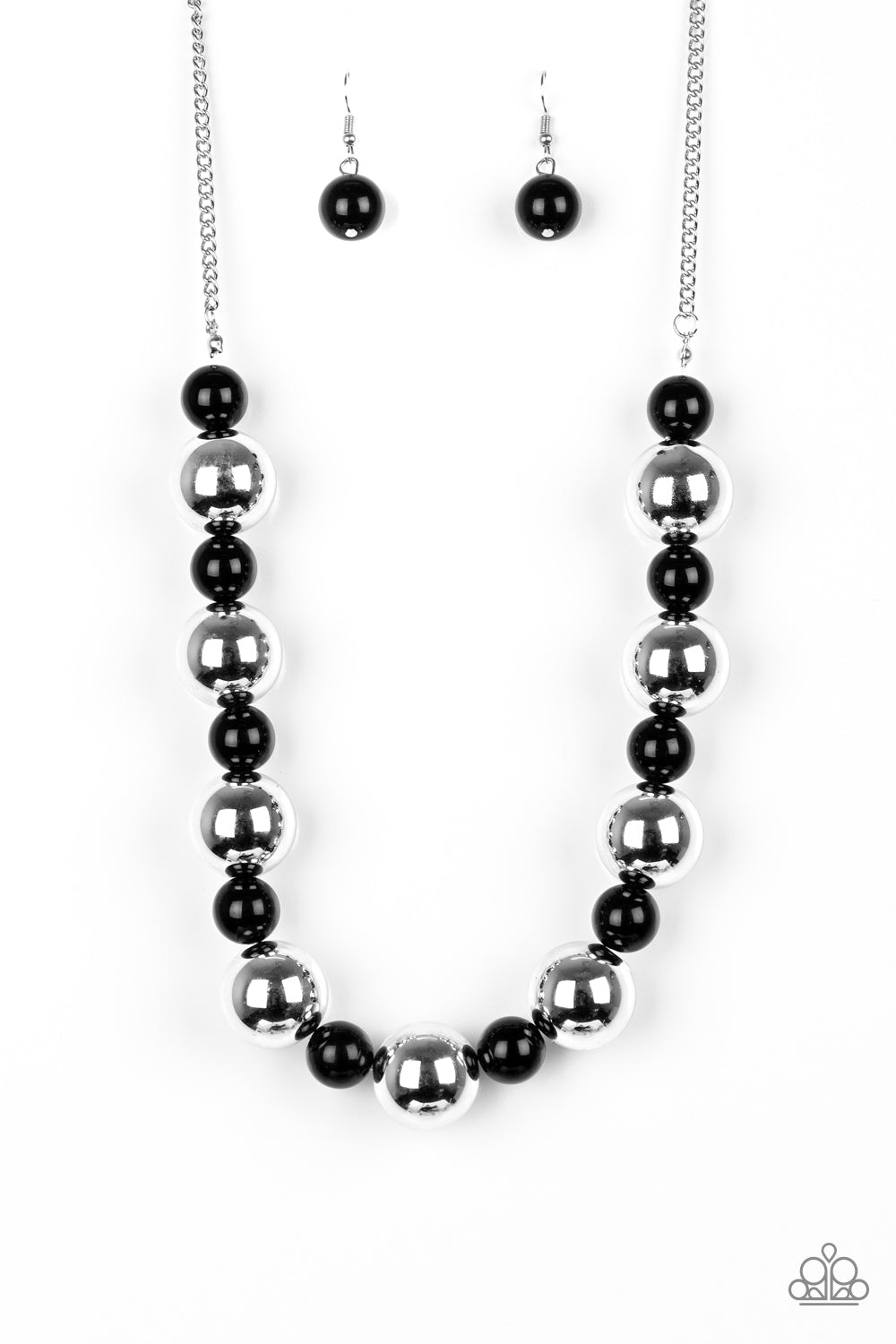 Polished black beads and dramatic silver beads drape below the collar for a perfect pop of color. Features an adjustable clasp closure.