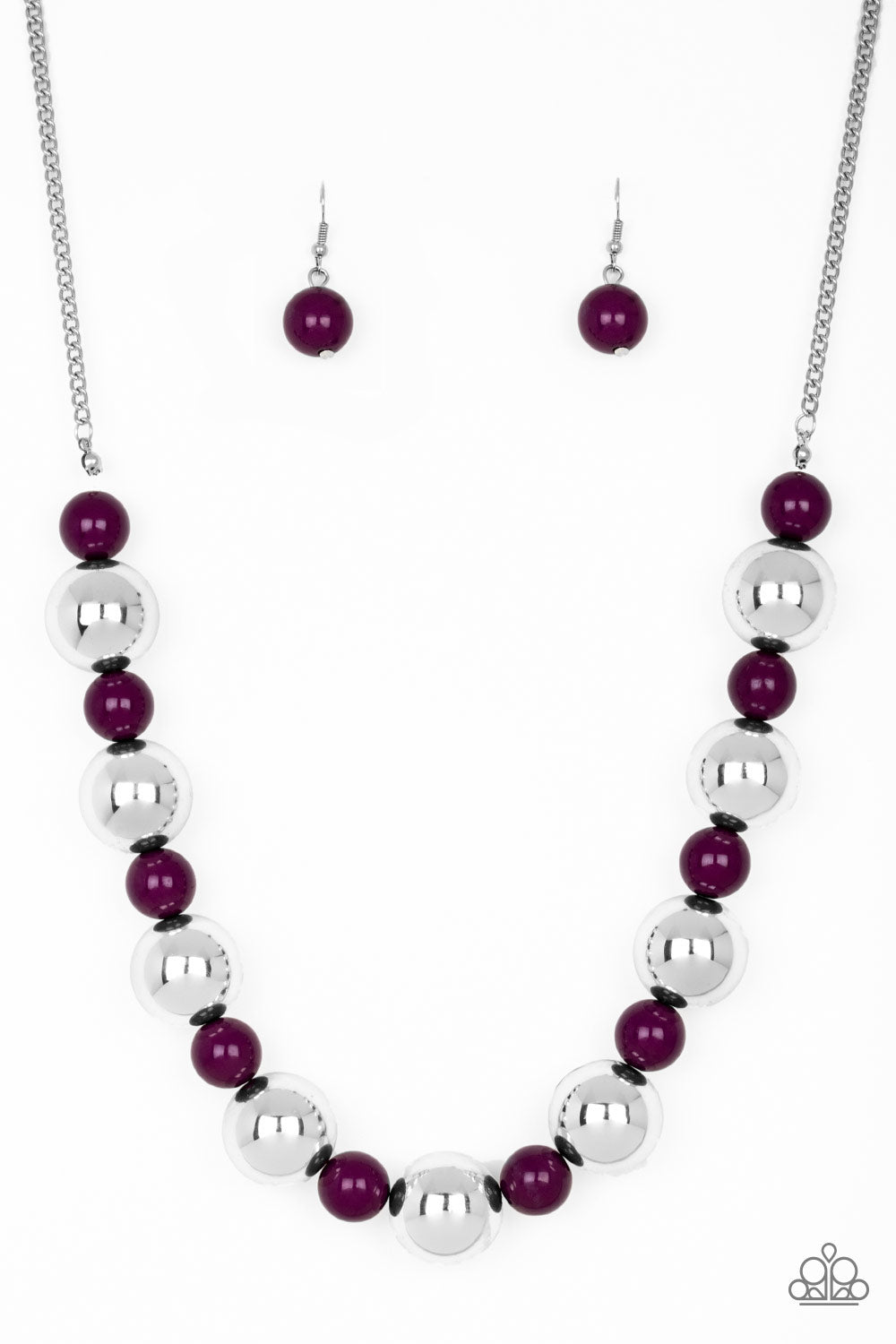 Polished purple beads and dramatic silver beads drape below the collar for a perfect pop of color. Features an adjustable clasp closure.