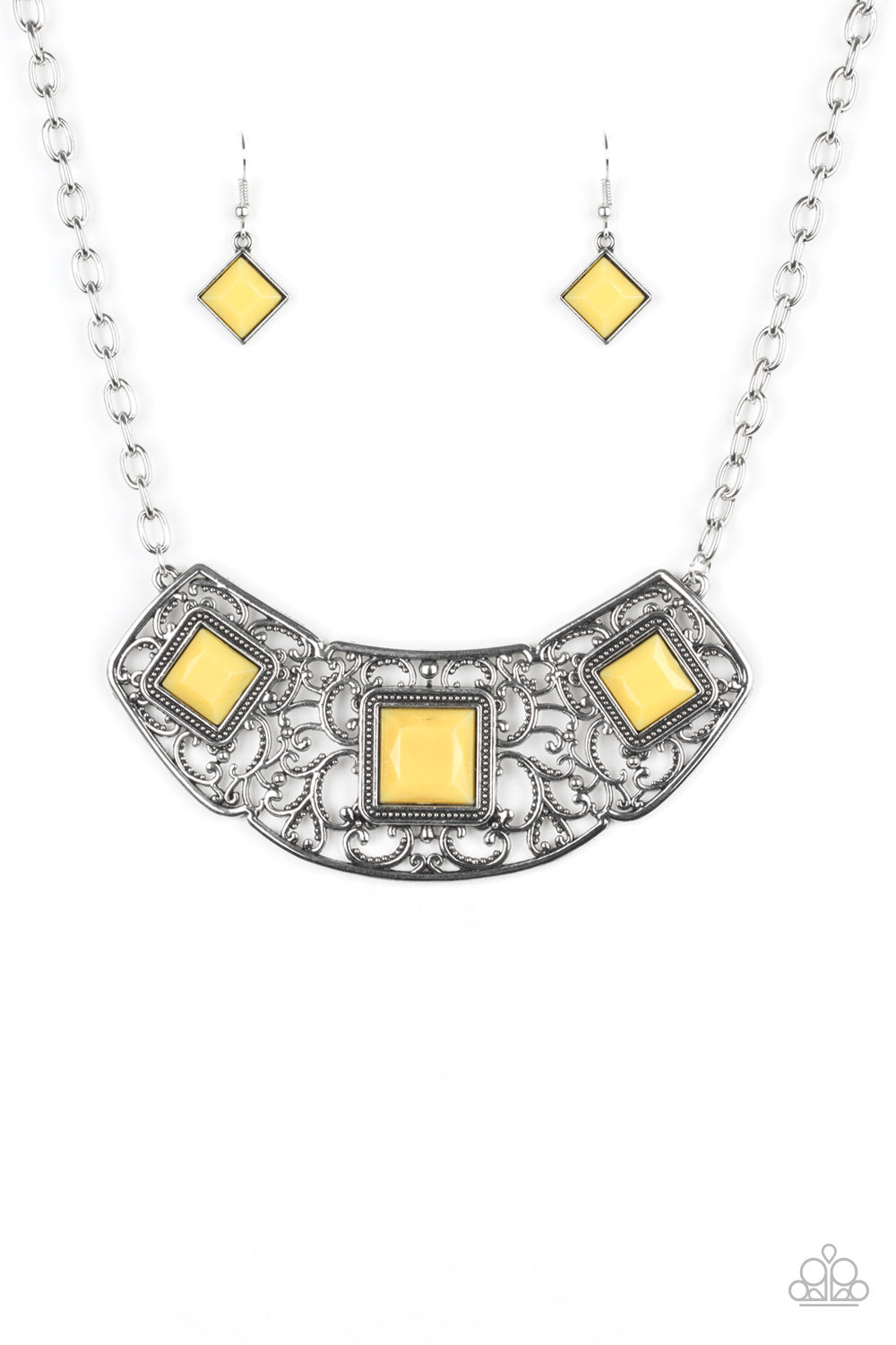 Glistening silver filigree spins into a dramatic pendant below the collar. Square yellow beads are pressed into the airy frame for a colorful finish. Features an adjustable clasp closure.