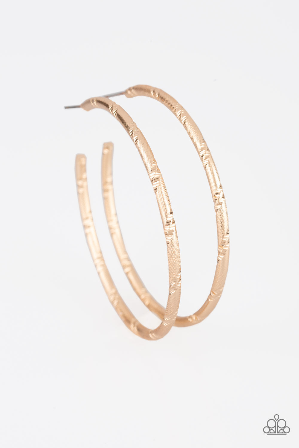 Etched in ribbons of diamond-cut shimmer, a shiny gold hoop curls around the ear for a classic look. Earring attaches to a standard post fitting. Hoop measures 2 1/4" in diameter.