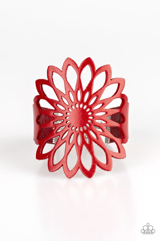 Stenciled in an airy wildflower pattern, a shiny red leather band wraps around the wrist for a bold and colorful look. Features an adjustable clasp closure