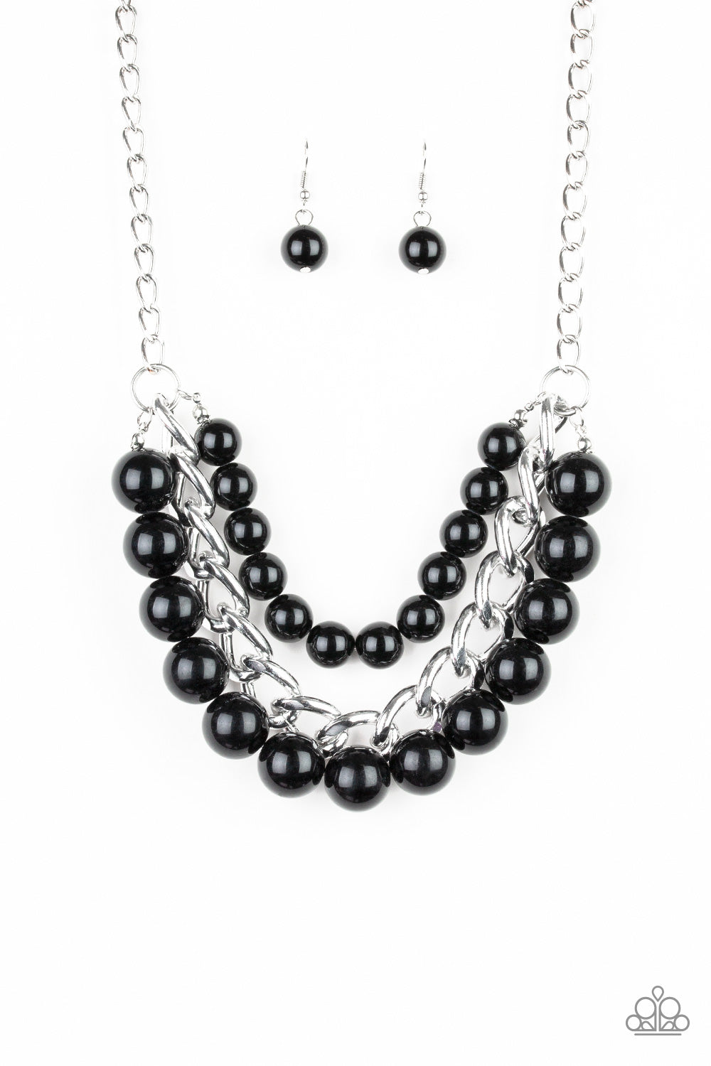Two strands of dramatic black beads flank one strand of oversized silver chain, creating statement-making layers below the collar. Features an adjustable clasp closure.