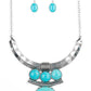 Oversized turquoise stone accents alternate with mismatched silver frames, coalescing into a dramatic tribal inspired pendant below the collar. Features an adjustable clasp closure.