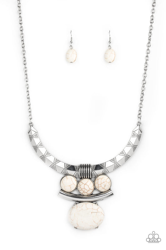 Oversized white stone accents alternate with mismatched silver frames, coalescing into a dramatic tribal inspired pendant below the collar. Features an adjustable clasp closure.