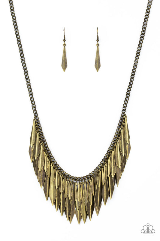 A collection of flared brass daggers swing from the bottom of a glistening brass chain, creating an edgy fringe below the collar. Featuring a subtle crease down the center, the shimmery discs gradually increase in size as they drip from the chain, adding an irresistible industrial flair to the look. Features an adjustable clasp closure.