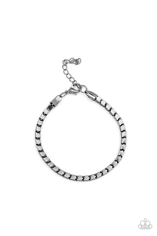 A thick strand of glistening gunmetal box chain links around the wrist for a bold look. Features an adjustable clasp closure.