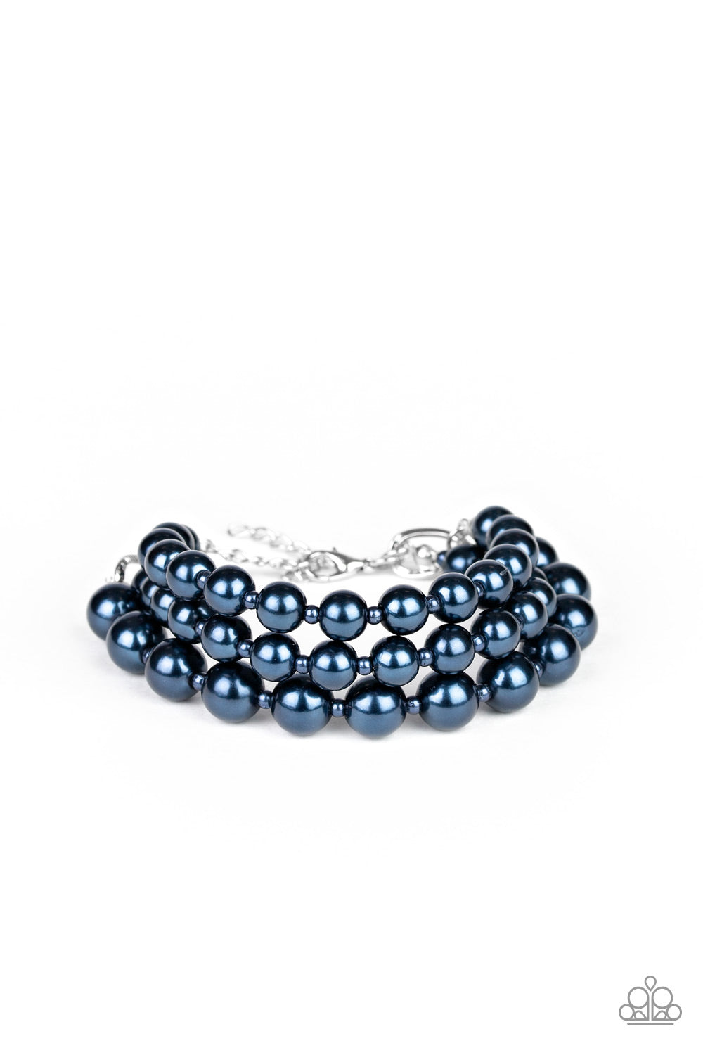 A bubbly collection of blue pearls are threaded along invisible wires, creating refined layers around the wrist. Features an adjustable clasp closure.