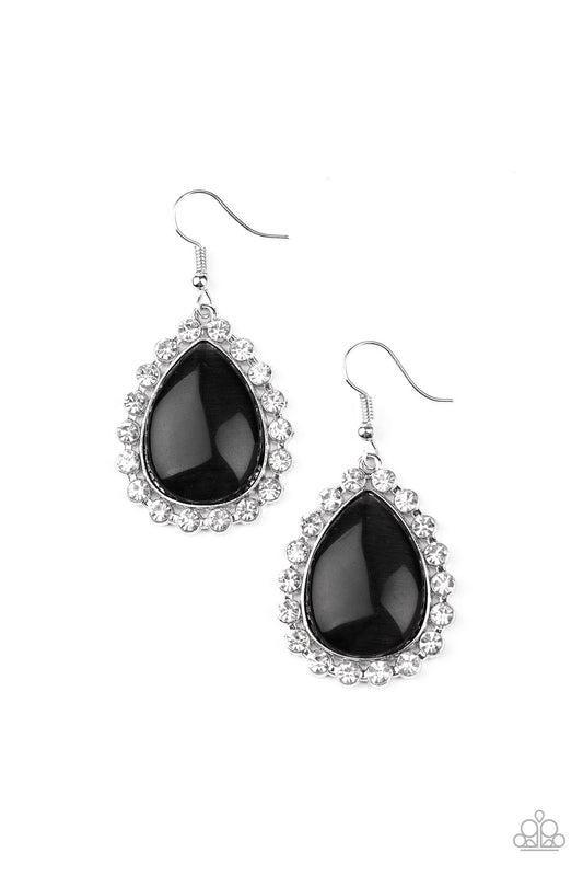 Glassy white rhinestones encircle a glowing black cat's eye stone teardrop, creating an elegant frame. Earring attaches to a standard fishhook fitting.