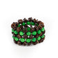 Rows of green wooden beads and brown wooden discs are threaded along stretchy bands that decoratively weave around the wrist, creating a tropical inspired statement piece.