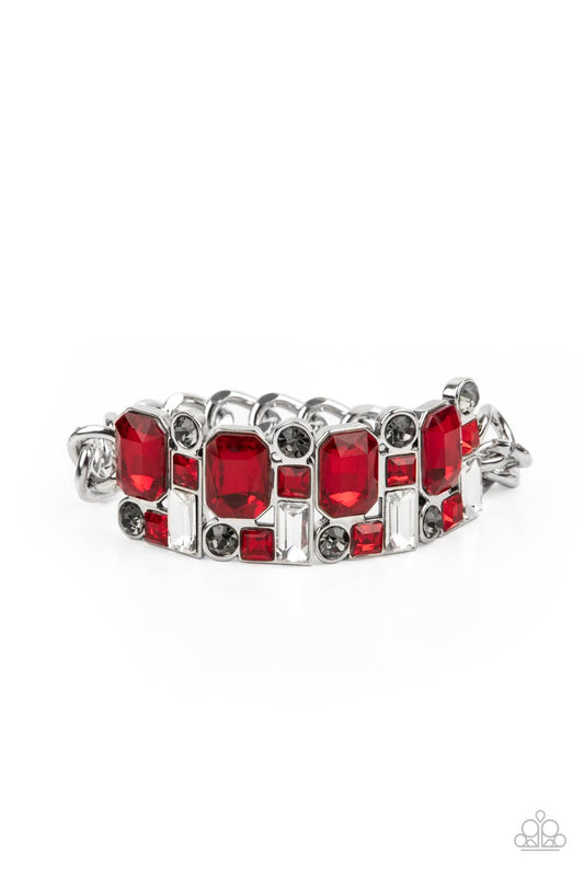 A mismatched collision of red, smoky, and white rhinestone encrusted frames are threaded along a stretchy band that attaches to a chunky strand of silver chain, creating jaw-dropping dazzle across the front of the wrist.
