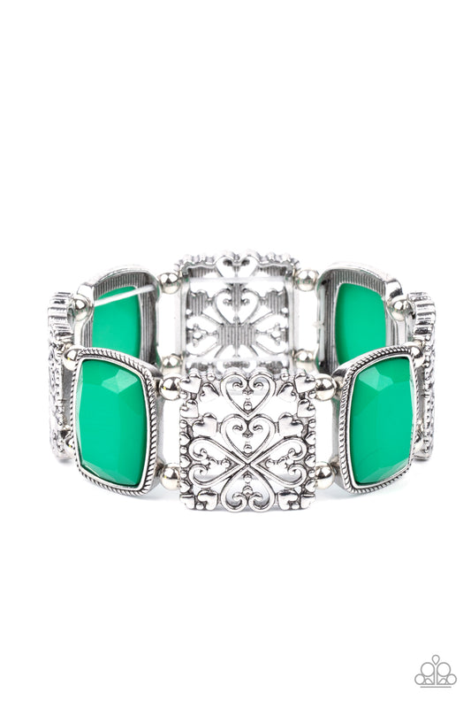 Infused with dainty silver heart accents, whimsically filled silver filigree frames and faceted Mint beads are threaded along stretchy bands around the wrist for a colorful flair.