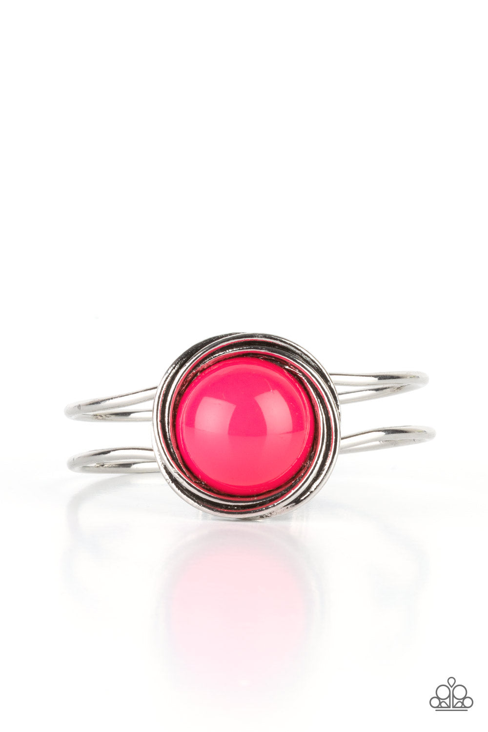 An oversized Raspberry Sorbet bead is pressed into the center of overlapping silver rings that coalesce into a dizzying centerpiece atop an airy silver bangle-like cuff, creating a bold pop of color atop the wrist. Features a hinged closure.