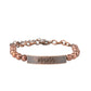 Stamped in the word, "Mama," a curved copper plate attaches to strands of copper beads threaded along invisible wire around the wrist, creating a sentimental centerpiece. Features an adjustable clasp closure.