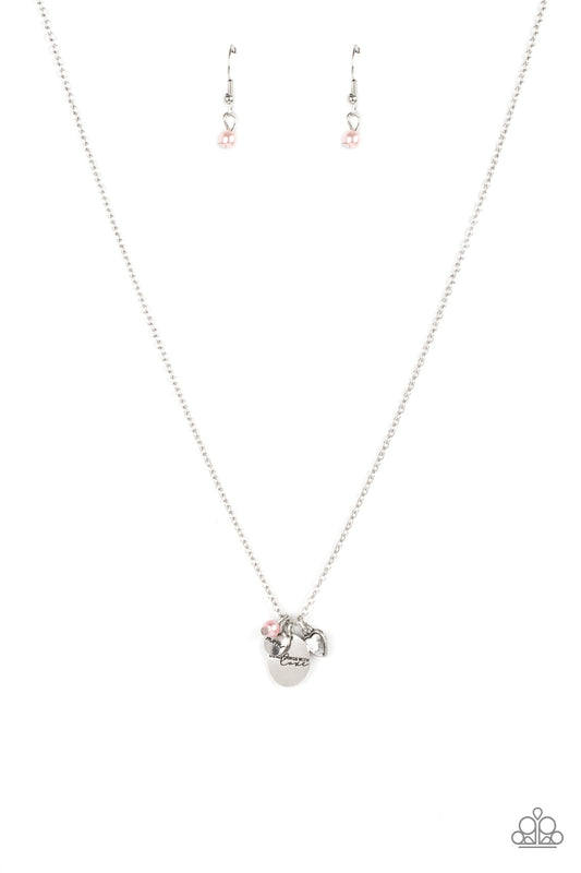A whimsical charm collection including, a pink pearl, glittery rhinestone heart, a dainty silver disc stamped in the word, "Mom," and a silver pendant stamped in the motivational phrase, "Do all things with love," delicately glide along a dainty silver chain below the collar for an endearing fashion. Features an adjustable clasp closure.