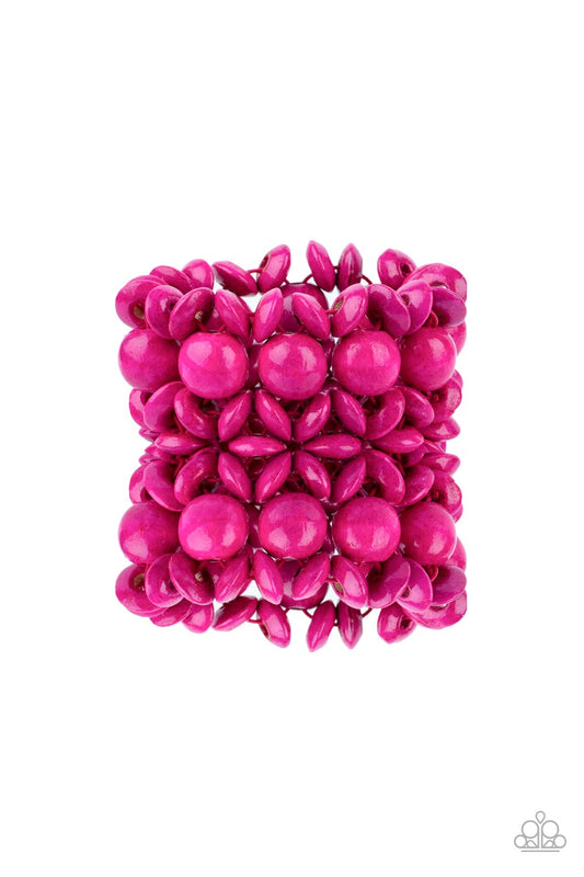 Brushed in a vibrant pink finish, an oversized collection of disc shaped and round wooden beads are threaded along ornately knotted woven stretchy bands around the wrist for a tropical inspired fashion.