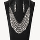 Enhanced with edgy sharpened tips, a seemingly infinite display of plain silver and white rhinestone encrusted teardrop discs dauntlessly drips from an interconnected backdrop of sleek silver links. The ferocious display of alternating dazzle fearlessly dances to its own beat, creating a flirtatiously fierce fringe below the collar. Features an adjustable clasp closure.