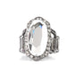 A dramatically oversized oval white gem adorns the center of a scalloped gunmetal frame dusted in dainty white rhinestones, creating a commanding centerpiece atop the finger. Features a stretchy band for a flexible fit.