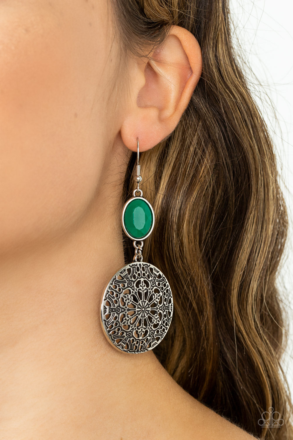 Blossoming with floral filigree, an antiqued silver disc swings from the bottom of a dewy Leprechaun bead for an enchanted fashion. Earring attaches to a standard fishhook fitting.