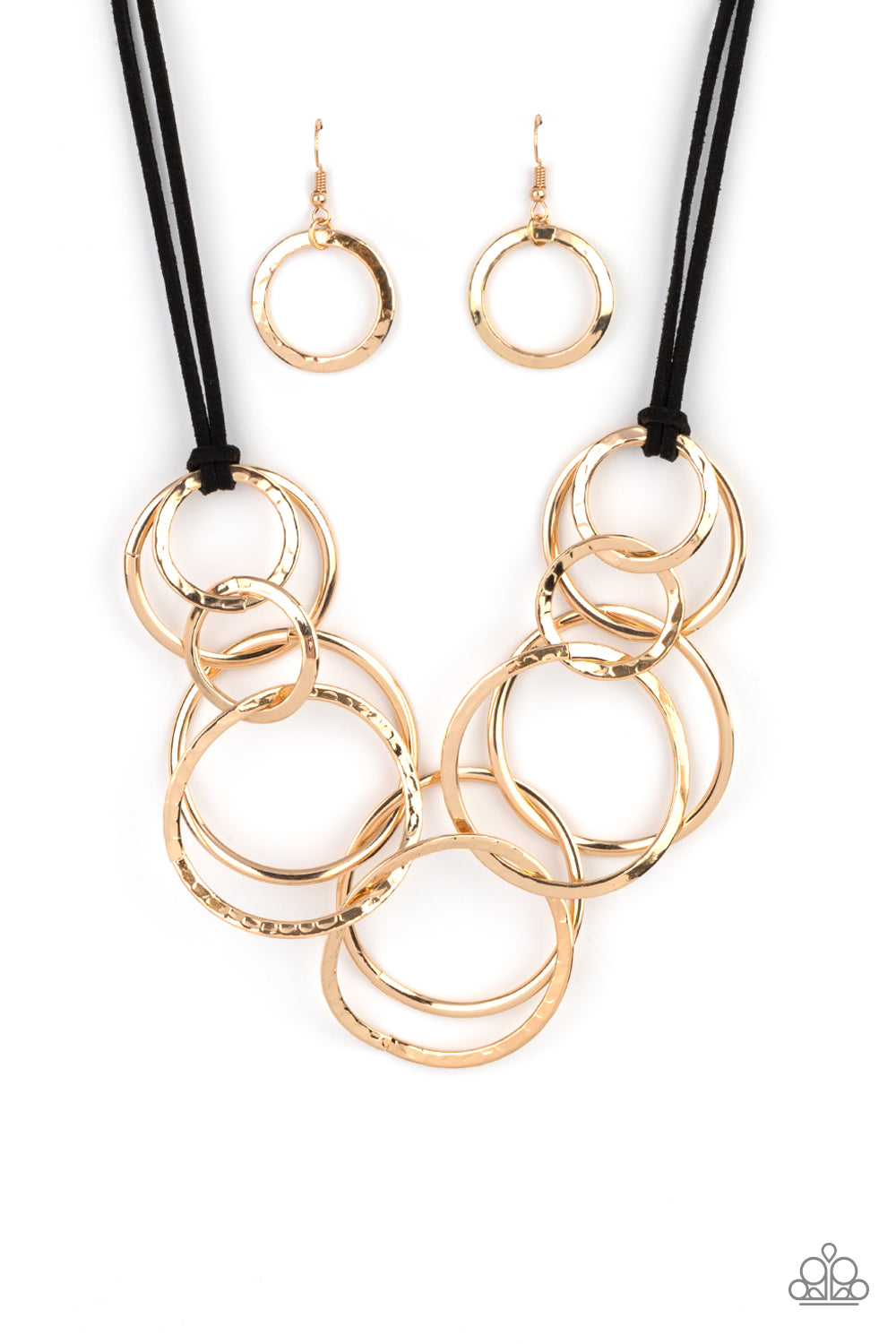 Black suede cords knot around a mismatched assortment of hammered gold rings that interlock below the collar, creating two rows of dizzying texture. Features an adjustable clasp closure. Sold as one individual necklace. Includes one pair of matching earrings.