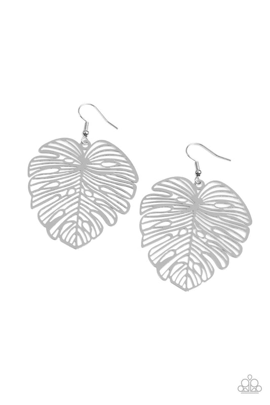 A stenciled silver palm-like leaf delicately swings from the ear, creating a refined seasonal display. Earring attaches to a standard fishhook fitting.