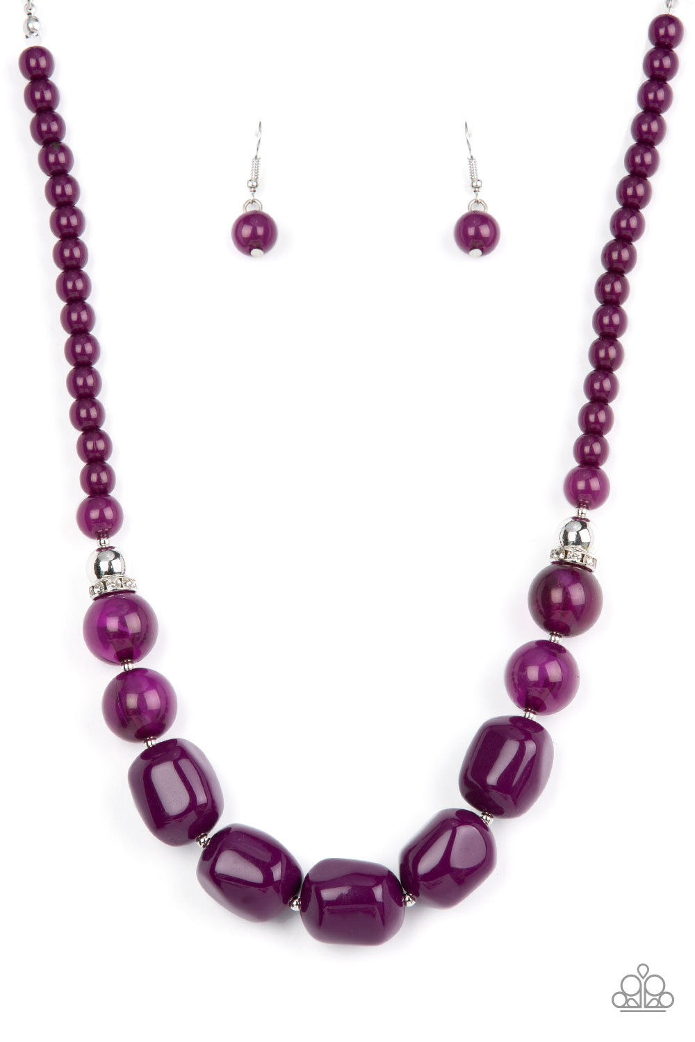 Accented with bright silver beads and glittery rhinestone accents, a row of oversized subtly faceted plum beads gives way to marbled plum beads that transition to smaller opaque plum beads as they make their way around the collar for a modern fashion. Features an adjustable clasp closure.