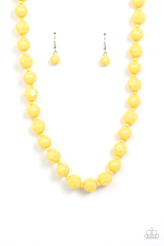 Infused with dainty yellow beads, a bubbly collection of smooth and faceted yellow beads alternate along an invisible wire below the collar for a sunny pop of color. Features an adjustable clasp closure.