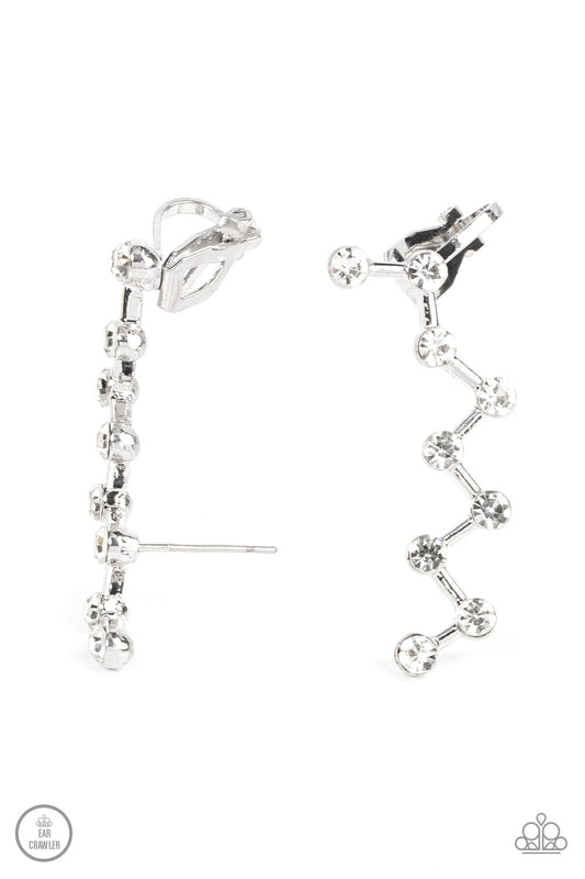 Strategically placed white rhinestones are connected by dainty silver bars as they zigzag up the ear, creating a stellar constellation. Earring attaches to a standard post fitting. Features a dainty cuff attached to the top for a secure fit