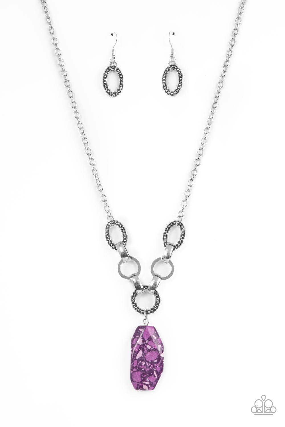 Featuring a colorful multicolored terrazzo finish, a faceted purple faux stone swings from a row of studded silver rings, flat silver hoops, and oversized silver fittings, creating an earthy pendant below the collar. Features an adjustable clasp closure.
