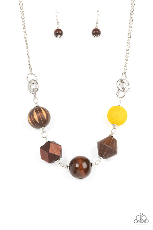 Infused with a solitaire yellow wooden bead, a mismatched assortment of studded silver hoops, textured silver rings, and oversized brown wooden beads delicately connect across the chest for a stylishly handcrafted fashion. Features an adjustable clasp closure.