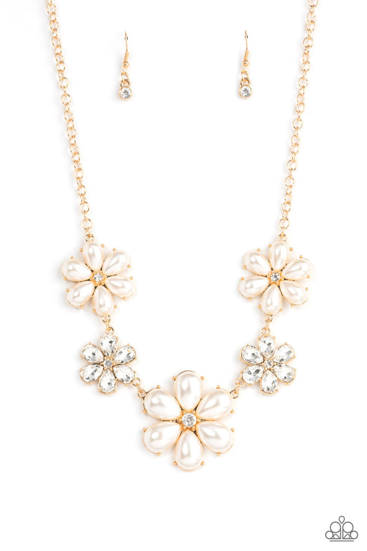 Featuring glassy white rhinestone centers, bubbly pearl petaled gold flowers gradually increase in size as they alternate with white rhinestone petaled flowers below the collar for a fierce floral fashion. Features an adjustable clasp closure.