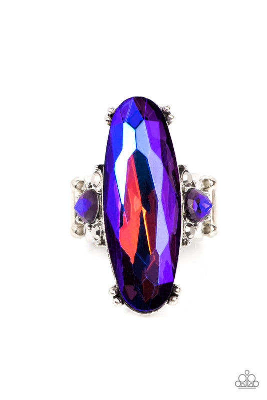 Featuring a stellar purple UV finish, an oversized blue oval gem sparkles between two dainty UV rhinestones atop a hematite dotted silver band for an out-of-this-world shimmer atop the finger. Features a stretchy band for a flexible fit.