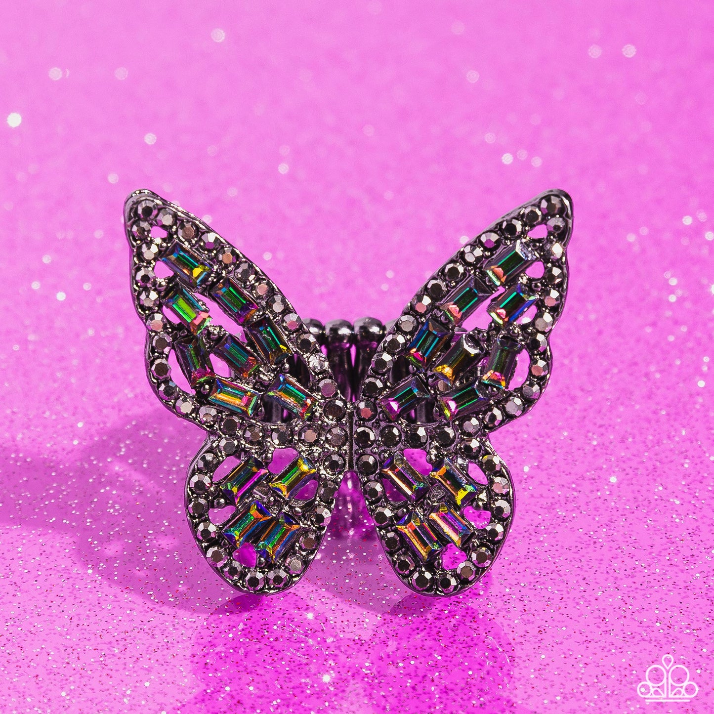 Dainty oil spill emerald-cut rhinestones are sprinkled across the gunmetal wings of a butterfly that is encrusted in dauntless hematite rhinestones for a dramatically dazzling finish. Features a stretchy band for a flexible fit.