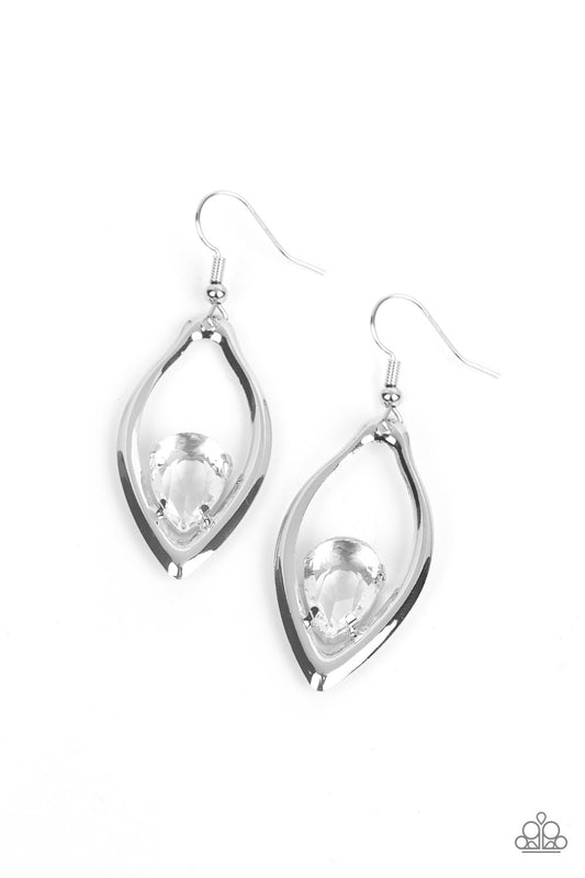 A glassy white teardrop gem is nestled inside the bottom of a warped silver frame, culminating into an edgy sparkle. Earring attaches to a standard fishhook fitting.
