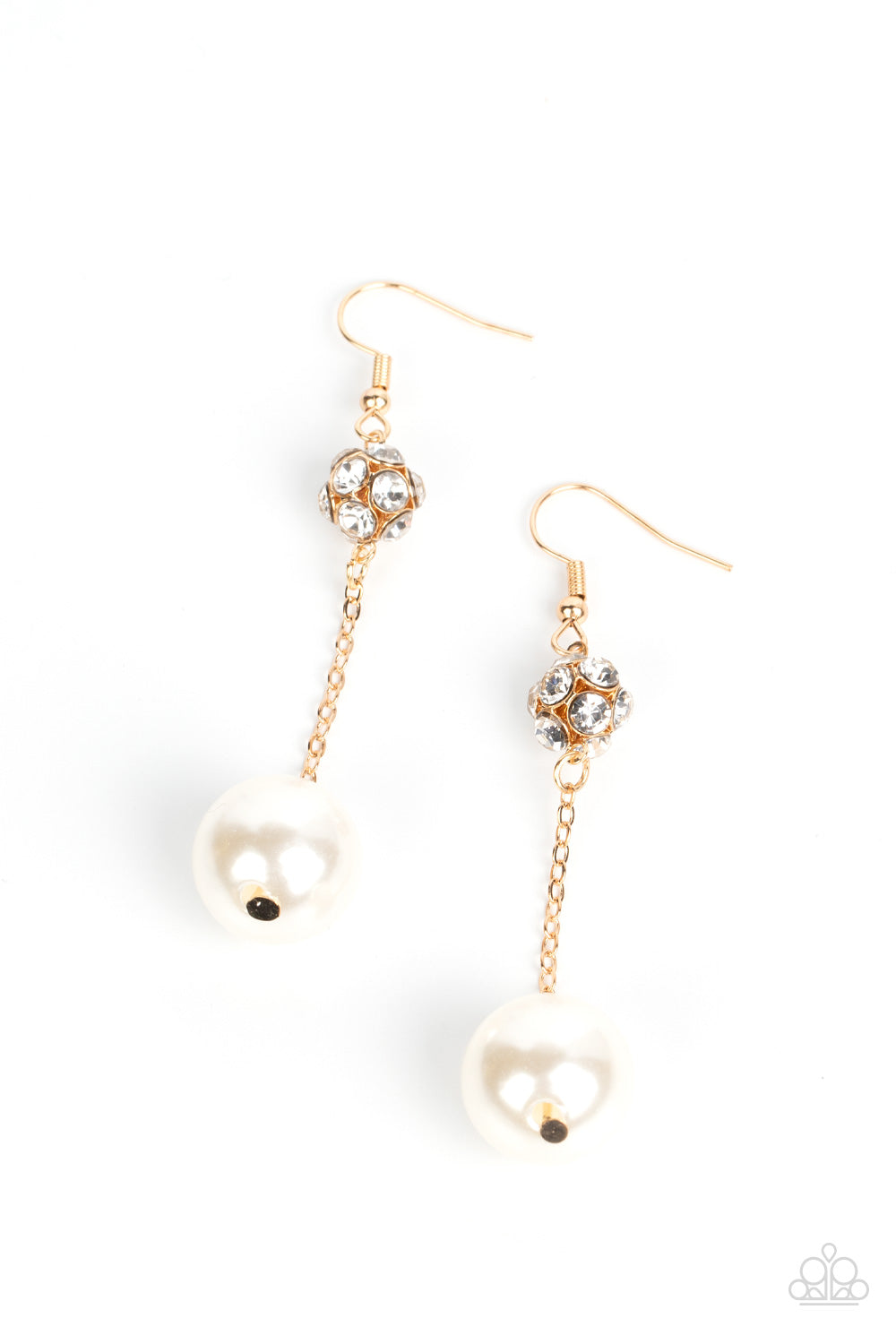 An oversized white pearl swings from the bottom of a dainty gold chain that is suspended from a white rhinestone encrusted gold bead, resulting in a timeless twist. Earring attaches to a standard fishhook fitting.  Sold as one pair of earrings.