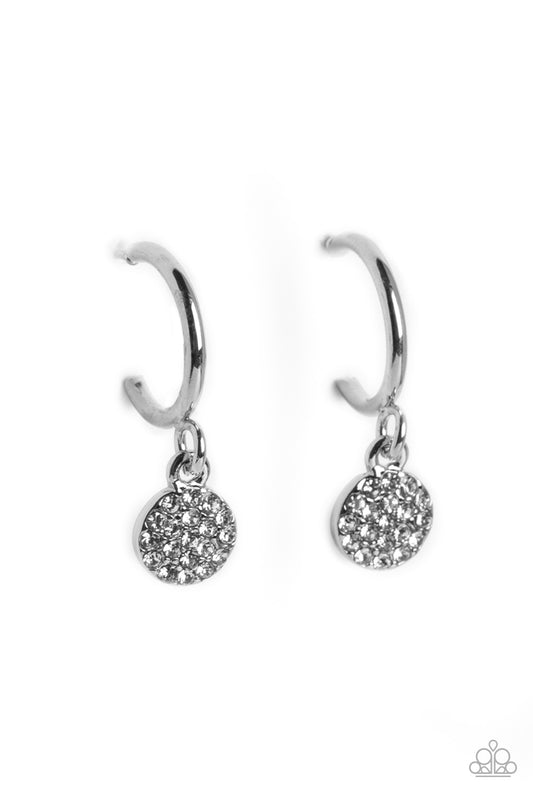 Swinging from a glistening silver hoop, a dainty silver disc, embossed with white rhinestones glimmers, adding a subtle shimmer around the ear. Earring attaches to a standard post fitting. Hoop measures approximately 1/2" in diameter.
