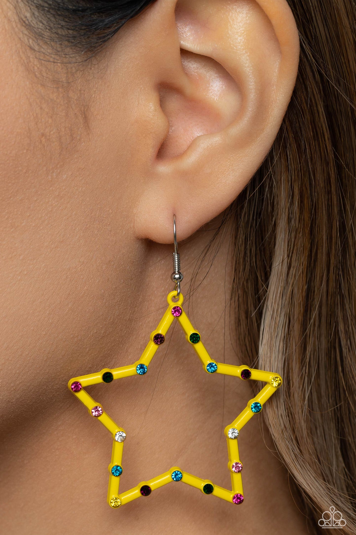 Yellow star frames, dotted with dainty colorful rhinestones, reflects light off its colored surface for a fashion-forward statement. Earring attaches to a standard fishhook fitting.