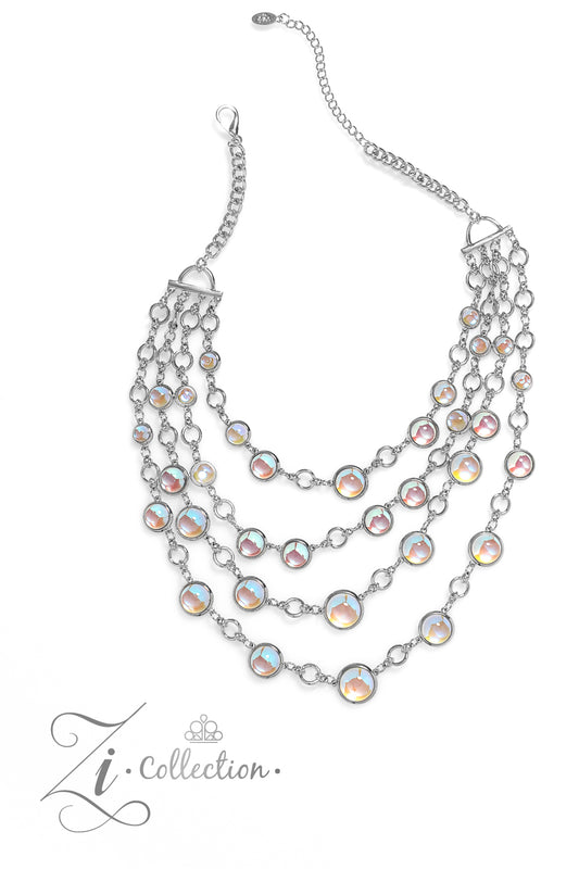 A dizzying display of silver hoops drapes across the chest in effervescent layers. Smooth, glassy beads, brushed in swirls of pastel iridescence, bubble up from some of the open, circular frames, further exaggerating their staggered size and placement, and showcasing their dreamy opalescent finish. With every new angle, a different hue emerges from the glassy beads, mimicking the reflective surface of water in a tropical paradise and emitting an air of serenity. Features an adjustable clasp closure.