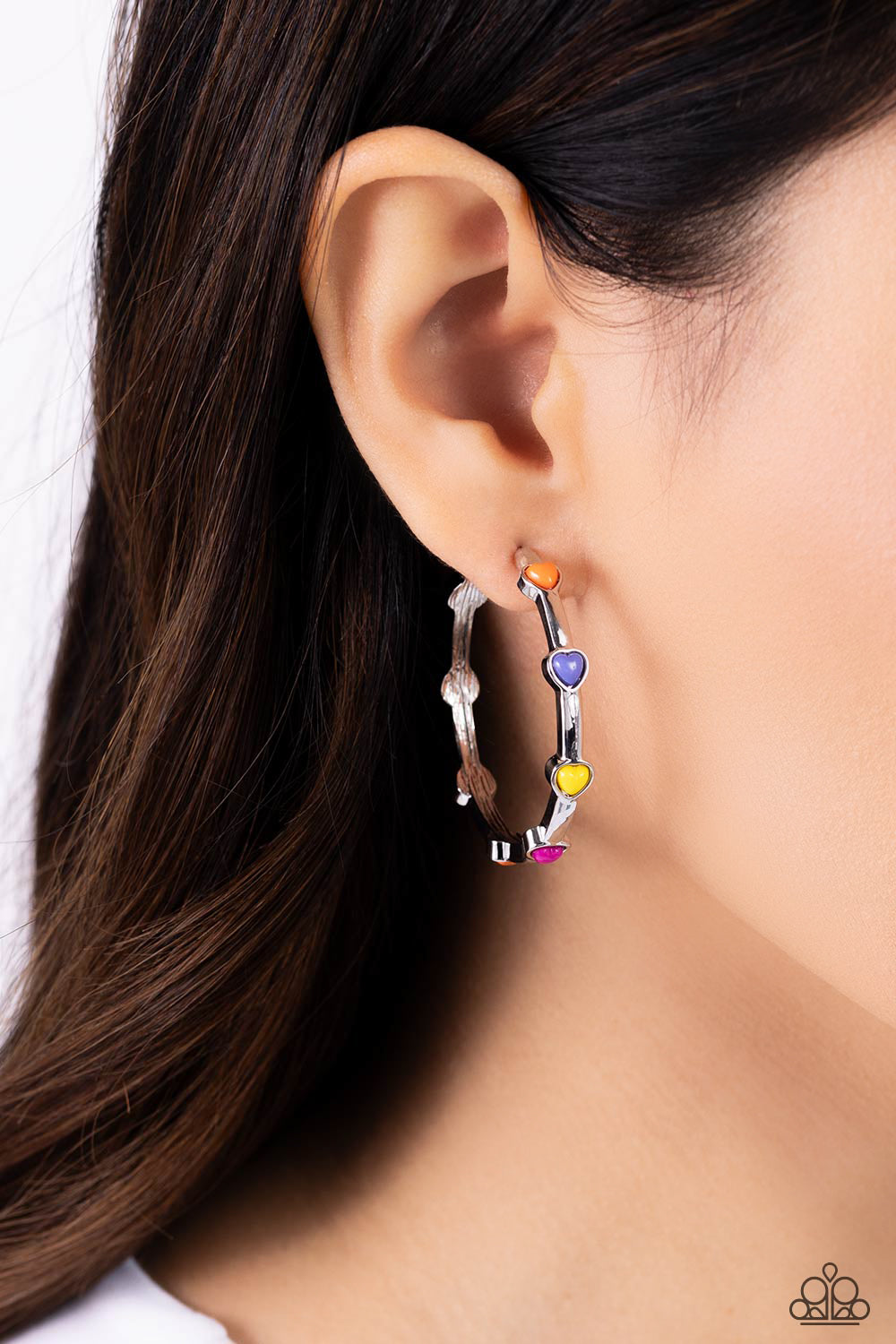 A charming collection of orange, Persian Jewel, High Visibility, and Rose Violet hearts adorn a classic silver hoop resulting in a romantic fashion. Earring attaches to a standard post fitting. Hoop measures approximately 1 1/2" in diameter.